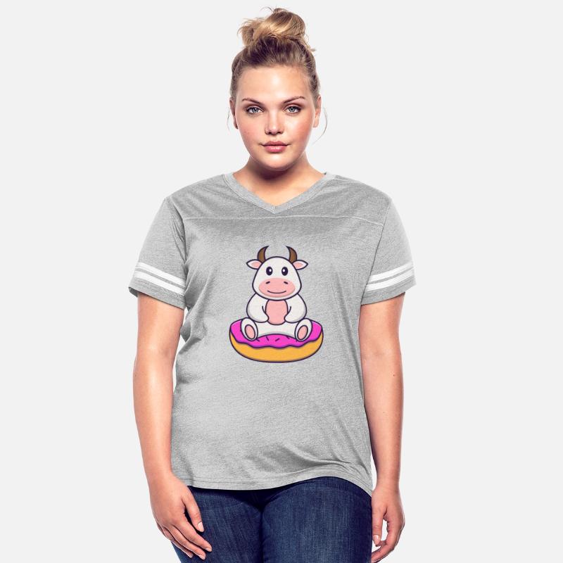 Cute Cow Is Sitting On Donuts