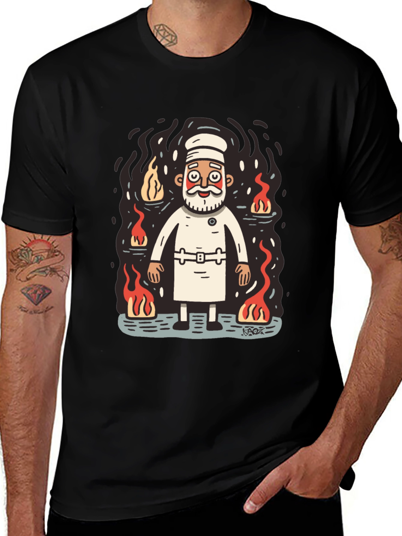 Chef surrounded by flames graphic tee